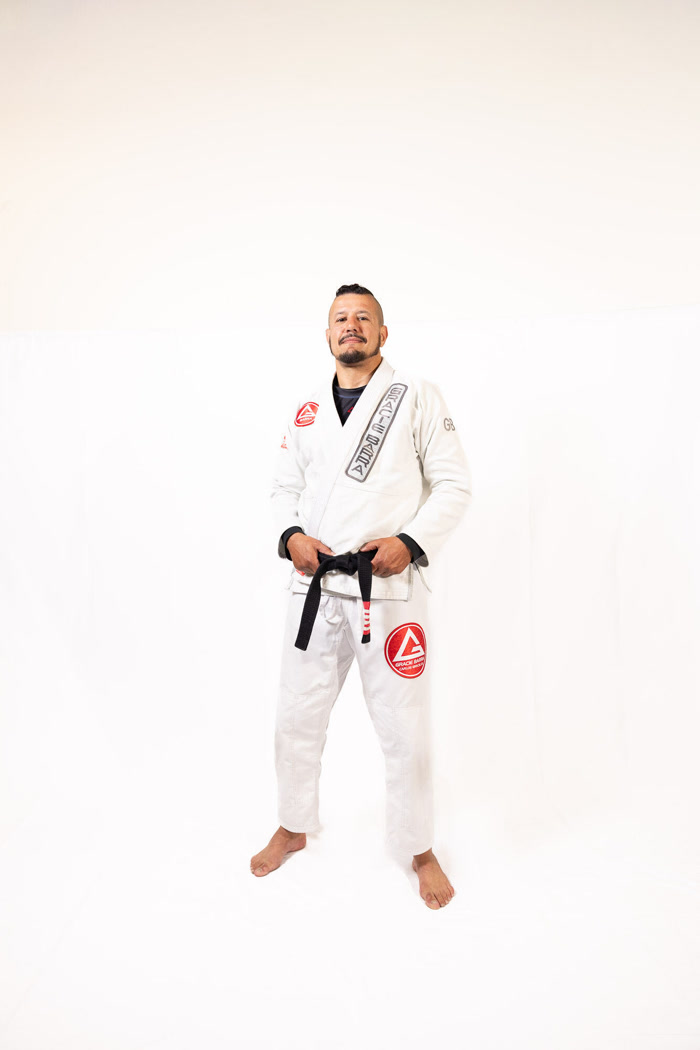 Professor Sardinha in a white gi with a black belt